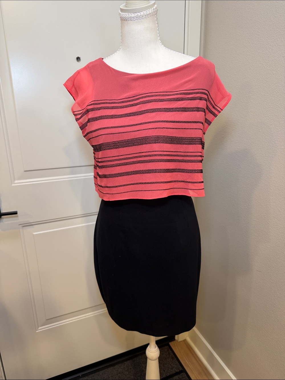 Bebe black dress with a Striped Coral Pink Crop Top over the dress.